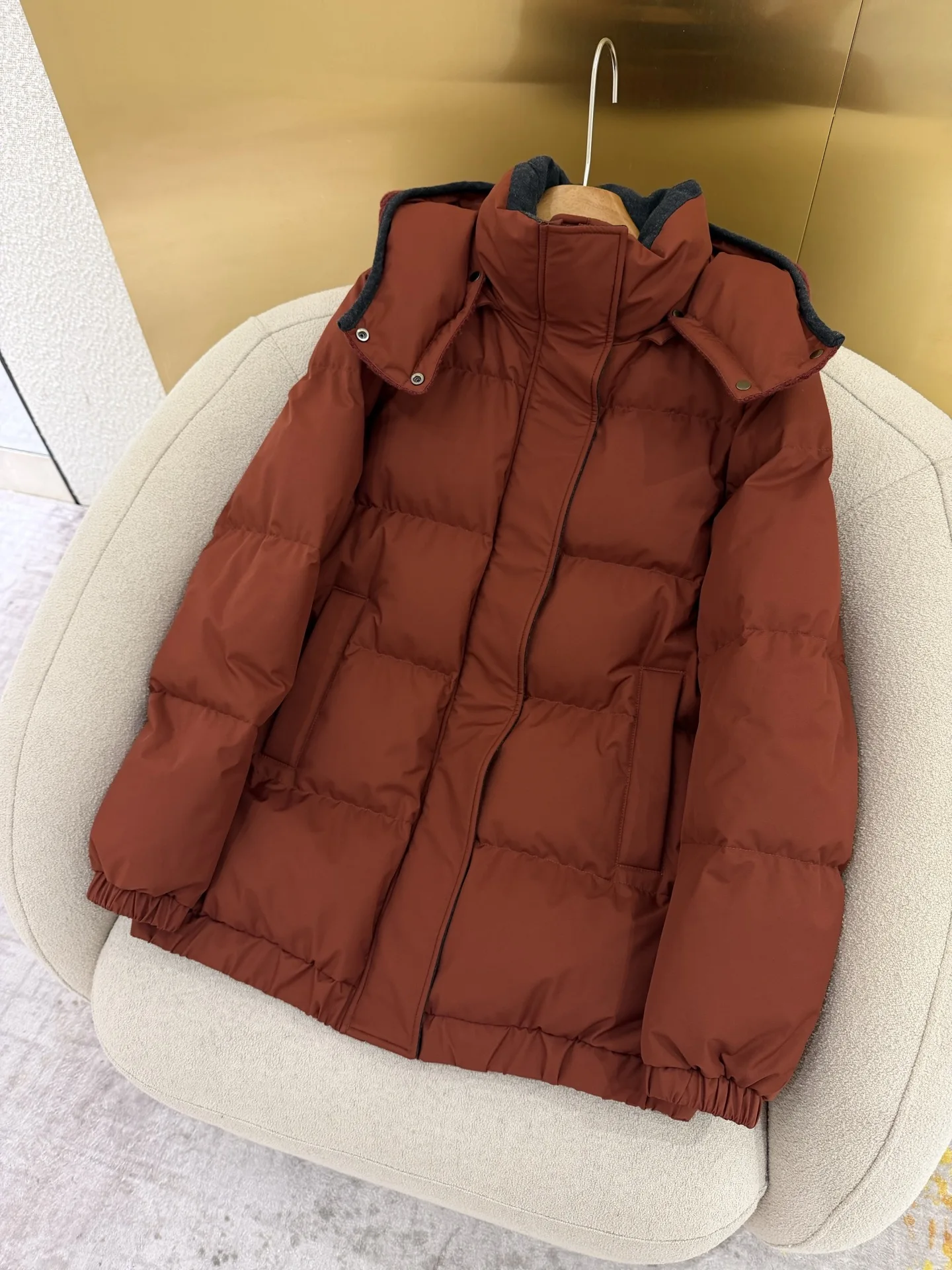 New winter wool knit hat; understated luxury goose-down jacket with detachable hood.NO.39