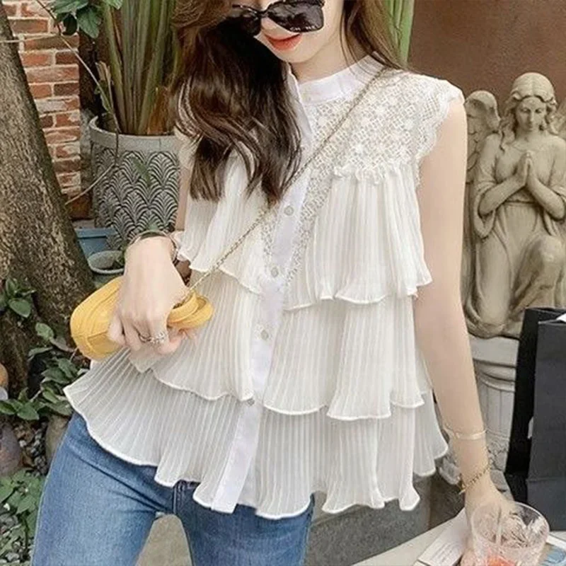 Camicia in chiffon senza maniche bianca scavata per le donne Estate nuova top trendy chic da strada con foglie di loto a pieghe larghe e impiombate