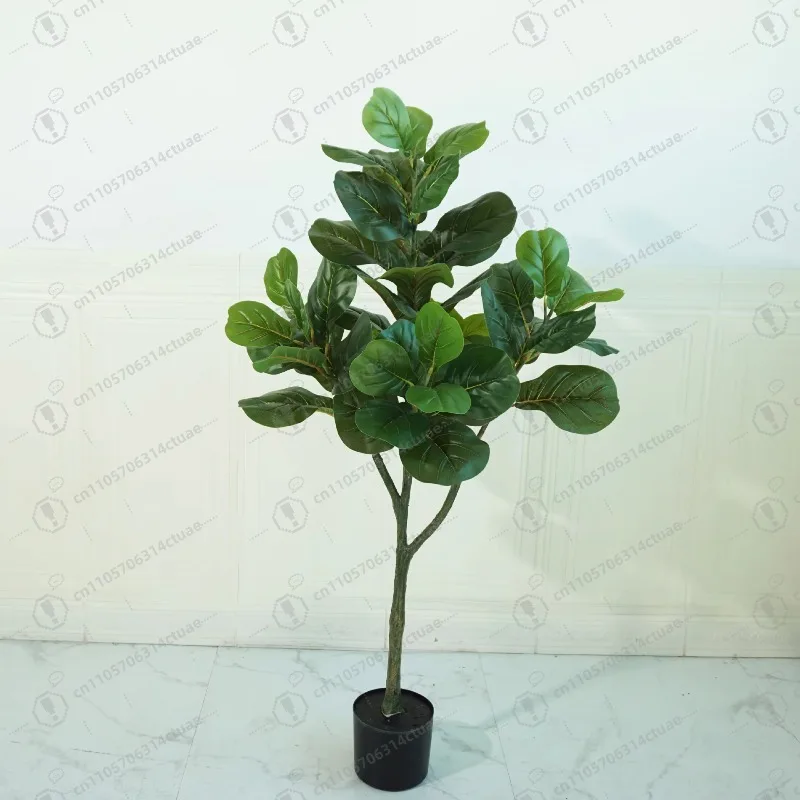 

Living room or window with large green indoor artificial piano leaf banyan plant soft plastic floor decoration
