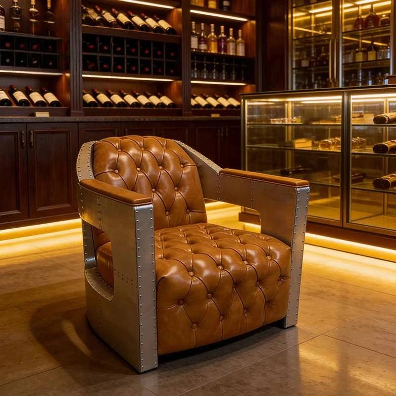 Luxury aluminum armchair, modern industrial style tufted leather lounge chair, side hollow design, suitable for bar living room