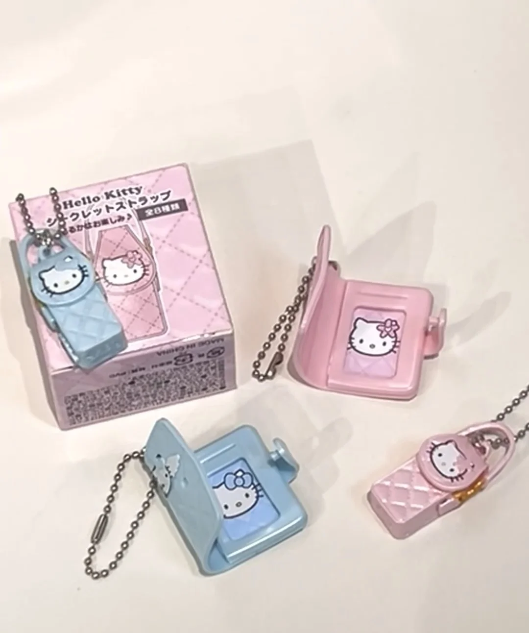 Sanrio Hello Kitty กระเป๋าจี้ Twisted Egg กล่องตาบอดอินเทรนด์เล่นเครื่องประดับ Periphery สีชมพูกระเป๋าของเล่นของขวัญวันเกิดหญิง