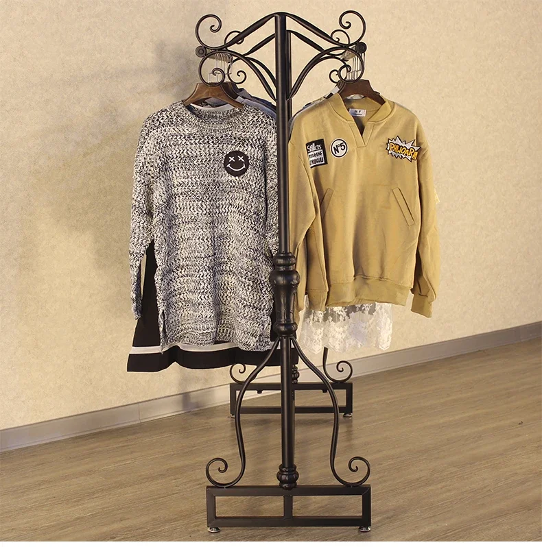 

Vintage clothing store double row central island floor hangers. Display rack.