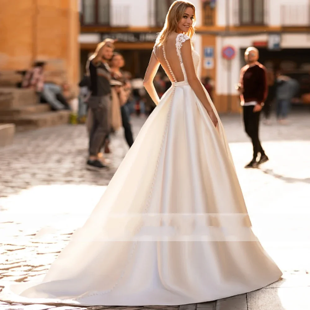 Flavinke Abiti da sposa in raso senza maniche personalizzati con linea A 2025 Abiti da sposa con retro illusione e strascico con tasche