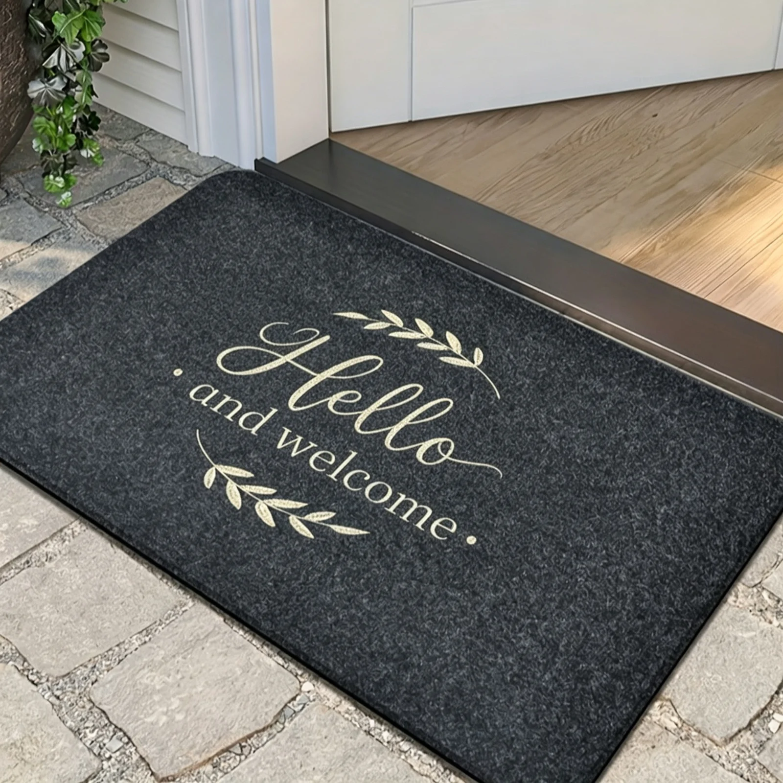 A Black Embroidered Flannel Doormat. New embroidery, Suitable for Indoor and Outdoor Decoration. Can Be Used as A Full Door Carpet, Mud Scraping Foot Pad, and anti Slip Pad. It Is an Ideal Choice for Home Decoration.