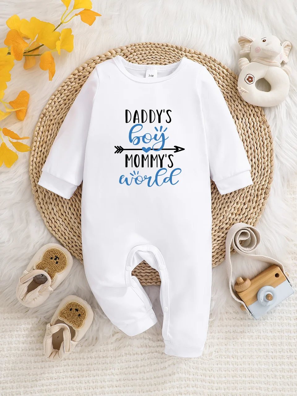 A baby long-sleeved onesie with interesting letter prints. It features a buttoned design for easy putting on and taking off