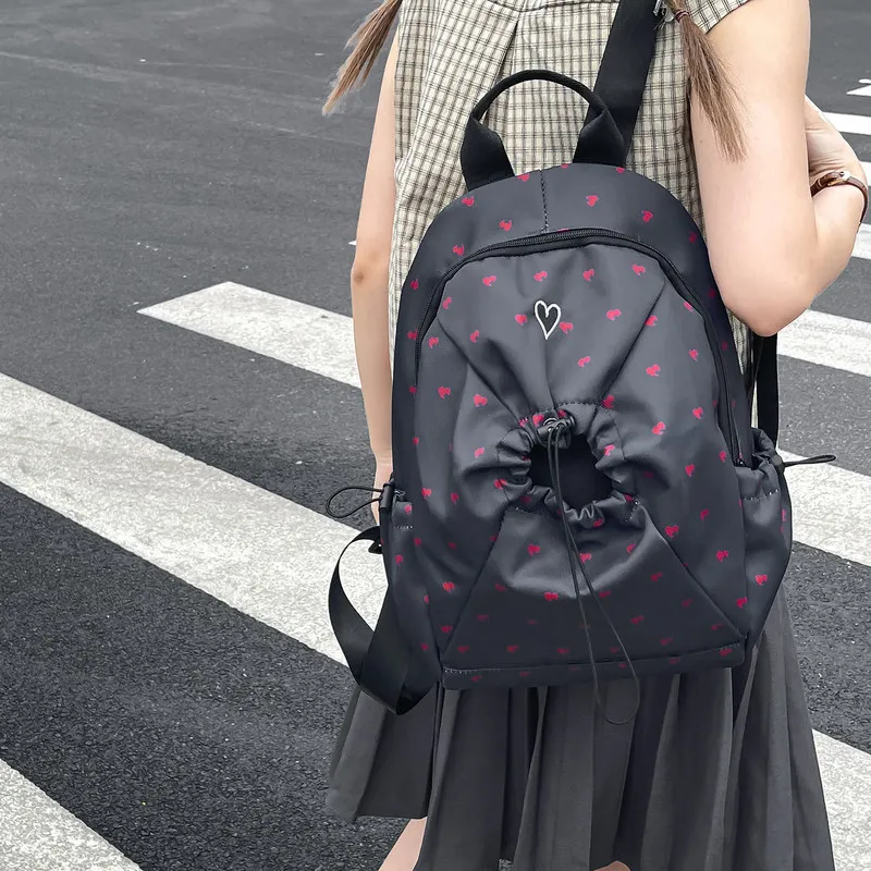 2026Heart-shaped large-capacity lightweight black backpack, college style, suitable for middle and high school students, travel