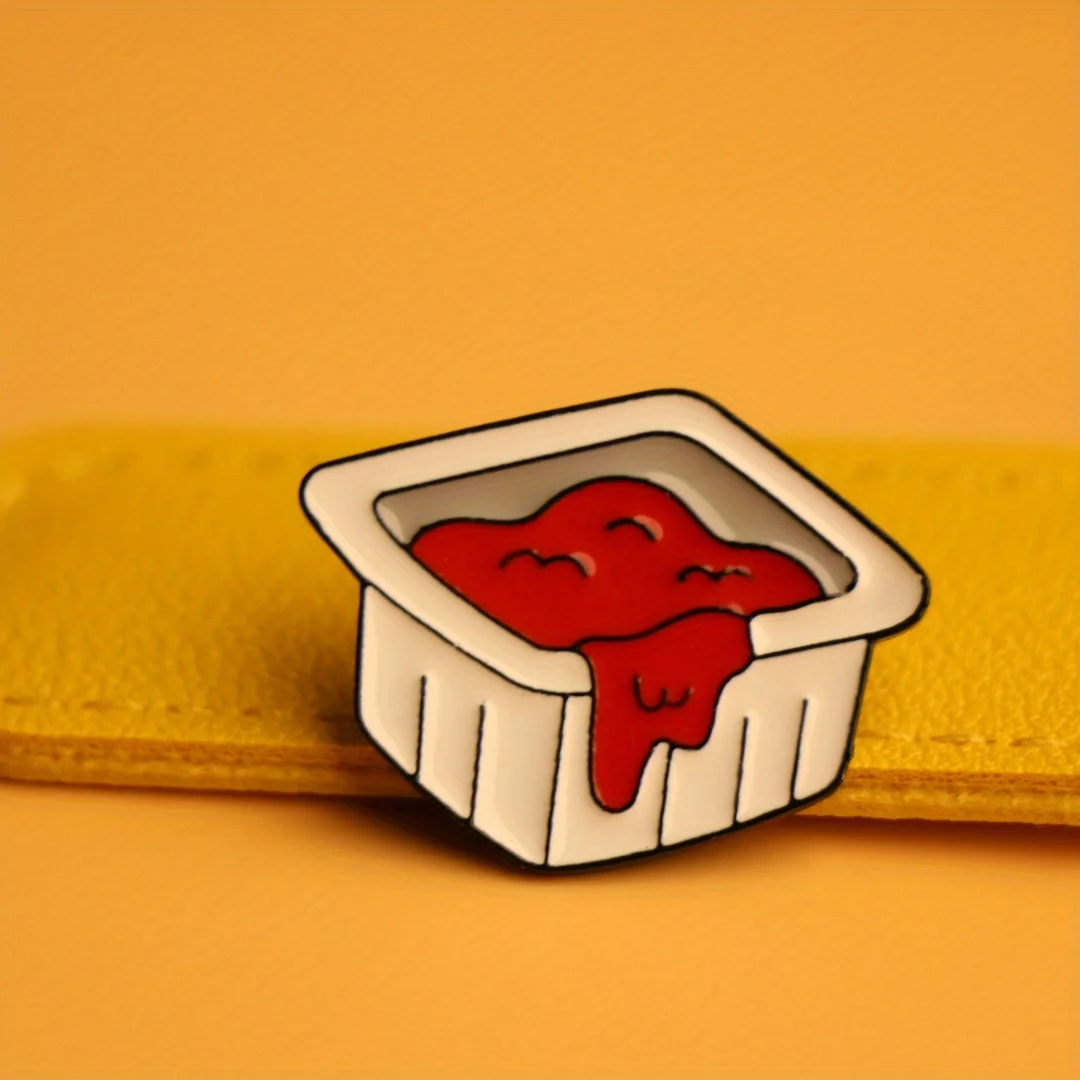 Quirky open ketchup bottle brooch for unisex backpack and clothing flair.