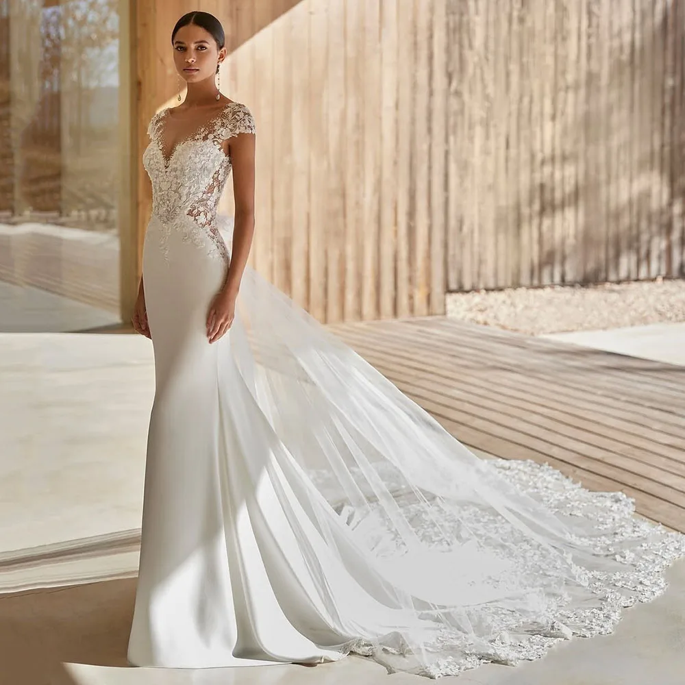 

Customized Backless Lace Bridal Gown With Flowing Train Appliques Bride Dress For Women Elegant Cap Sleeve 2025 Wedding Dress