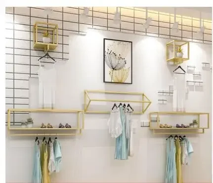 Clothing store display rack wall women's shop wall hanging hangers gold clothing rack side hanging combination.