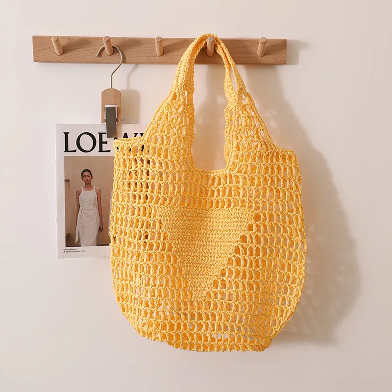 Bolsos de mano informales de paja hueca para mujer, bolsos de hombro tejidos de papel de diseñador, bolso de mano grande de playa de Color caramelo, 2023