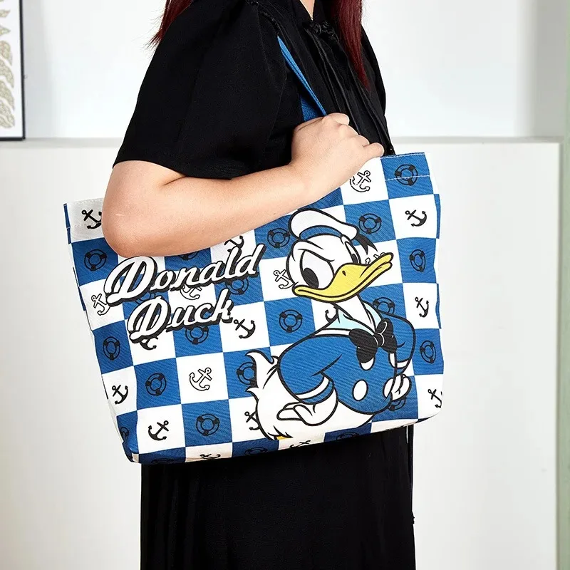 Bolso grande de lona de Stitch de Disney, bolso bonito de dibujos animados, bolso de compras de gran capacidad, bolso de mano para ir al trabajo, regalo de cumpleaños para niña, juguetes para niños