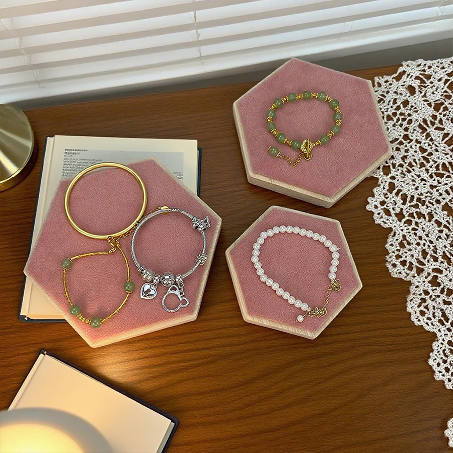 Hexagonal jewelry display stand, used for organizing and storing bracelets and necklaces.