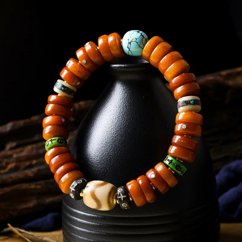 Original -style bracelet featuring bone inlays silver ingots and medicinal bead charms A collection of Tibetan prayer