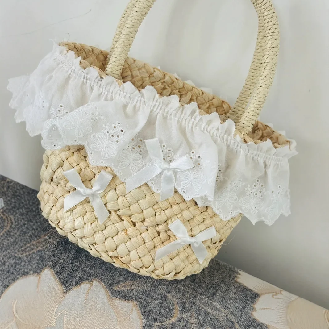 Niedliche Mini-Schleifen-Stroh-Eimertaschen für Frauen, Sommer-Spitzen-Strohtasche, handgefertigte gewebte Handtaschen und Geldbörsen, böhmische Strandtasche, Tragetasche, NEU