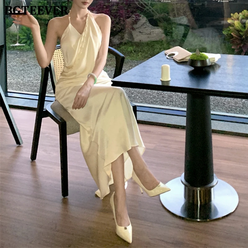 BGTEEVER エレガントなホルターパールノースリーブパッケージヒップサテンドレス女性のための春夏ファッションスリムウエストレディーススキニードレス