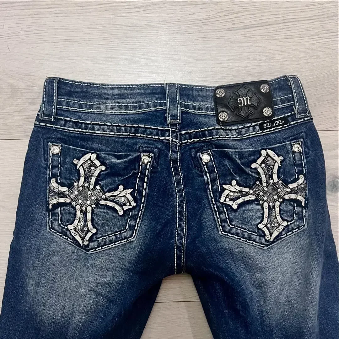 Individually designed sparkling rhinestone cropped jeans with embroidered pockets and heavy cuffed high-waisted straight pants