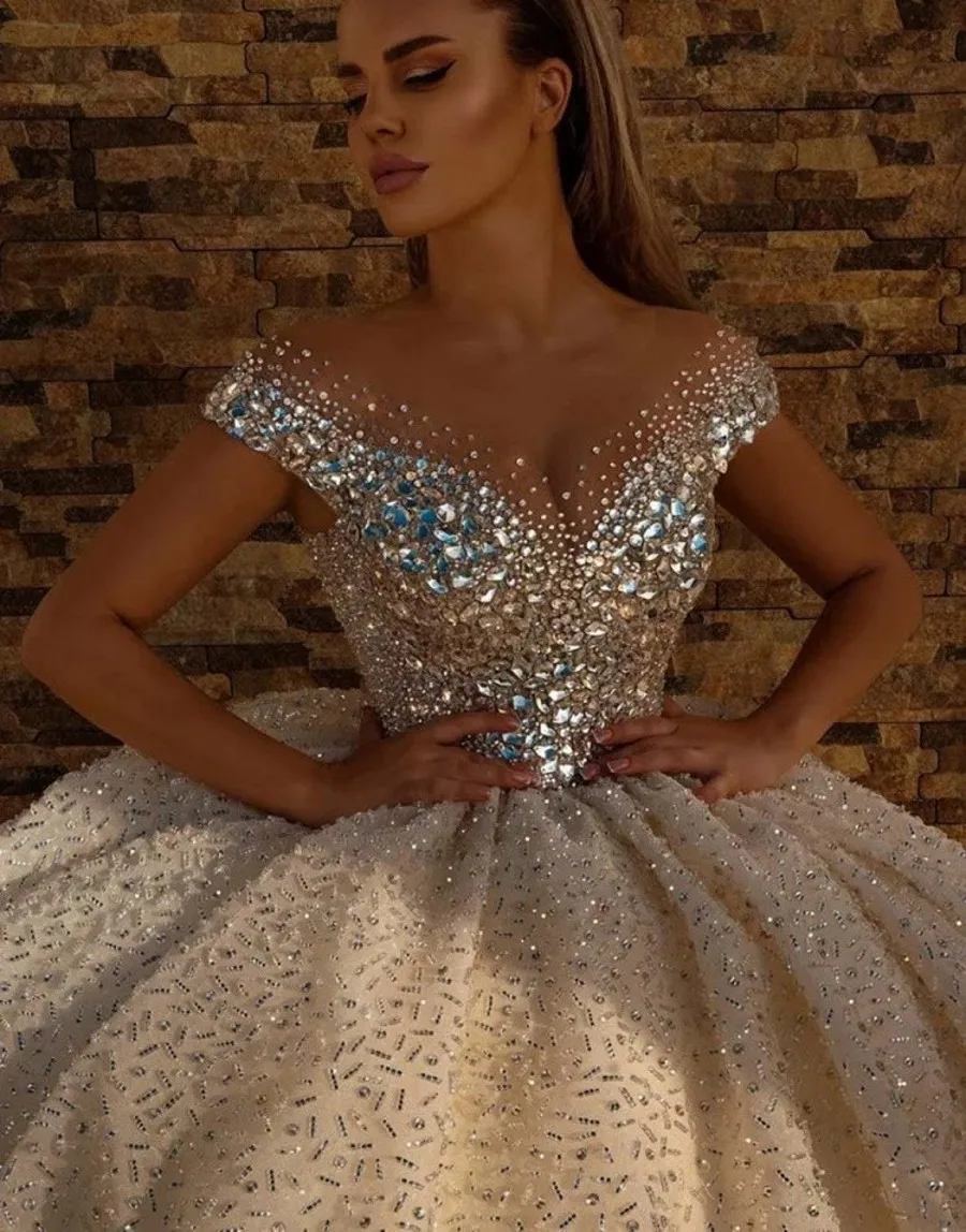 

Luxury Champagne Wedding Dresses 2026 Sheer Neck Beaded Crystal Ball Gown Satin Church Bride Bridal Gowns Vestido De Novia