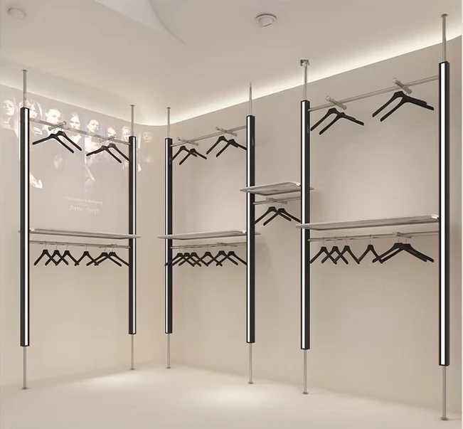 

Clothing store display shelves, wall columns, display shelves with lights, illuminated hanging clothes racks