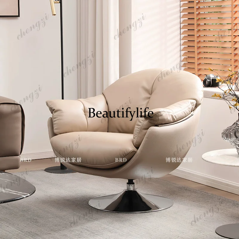 The first layer of cowhide single sofa is casual, swivel chair Italian living room, balcony, retro, single chair.