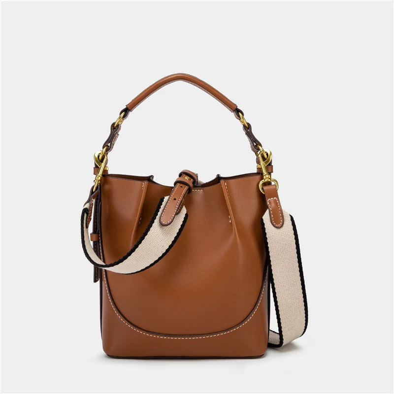 

Spain 2025 new women's bag brown pleated drawstring versatile hand-held bucket bag wide shoulder strap diagonal cross bag