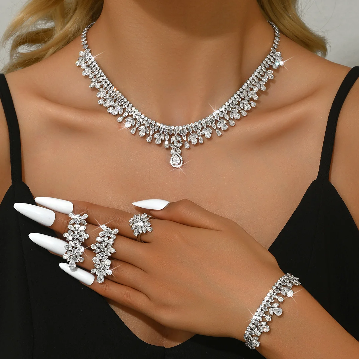 

High-end heavy-duty zircon pendant necklace, earrings, bracelet and ring set - perfect accessories for a formal event.