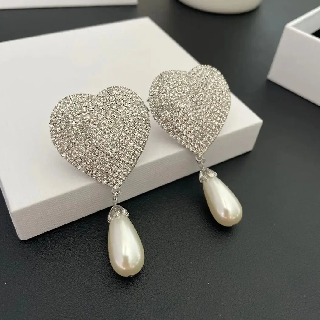 Orecchini cuore Qi qualità luce moda di lusso per le donne Aretes De Mujer Pendientes Boucle D'Oreille Orecchini Clip De Oreja