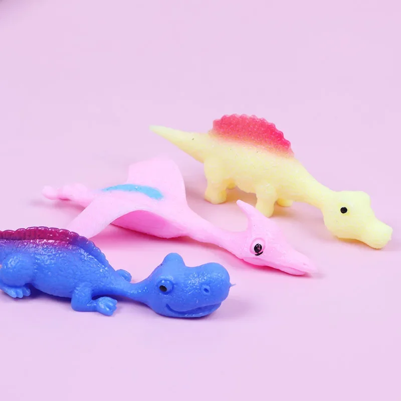 1PC Creative Dinosaur Finger Toys Kids Funny Cartoon Animals Anxiety Stress Relief Shooting Playing Toy Slingshot Catapult Game