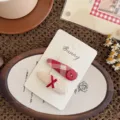Plaid Drop Button