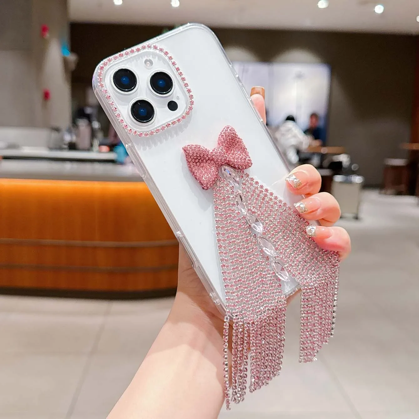 A niche luxury full diamond fringe bow rhinestone for iPhonexxs 11 1213 14 15 16 pro and promax series phone cases