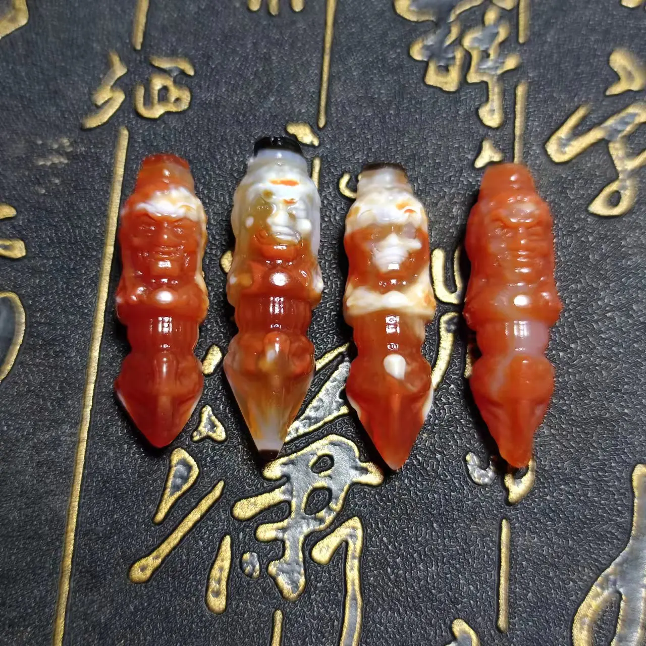 

4Pcs/Lot Red Agate Carved Tibetan God of Wealth Totem Dzi Beads Men&Women Amulet Vajra Shaped Amulet Pendant Free Shipping