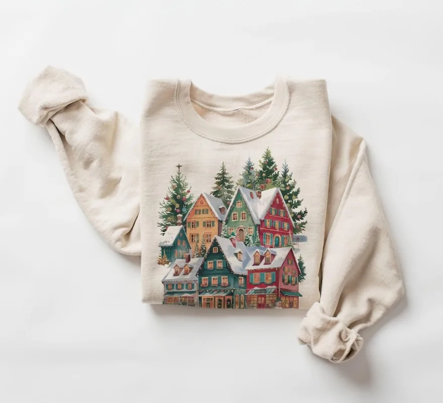 

Retro Bavarian Christmas Village Shops Sweatshirt 90s Vintage Decorated Pine Trees Snowman Deer Outfit Boho Unisex Hoodie
