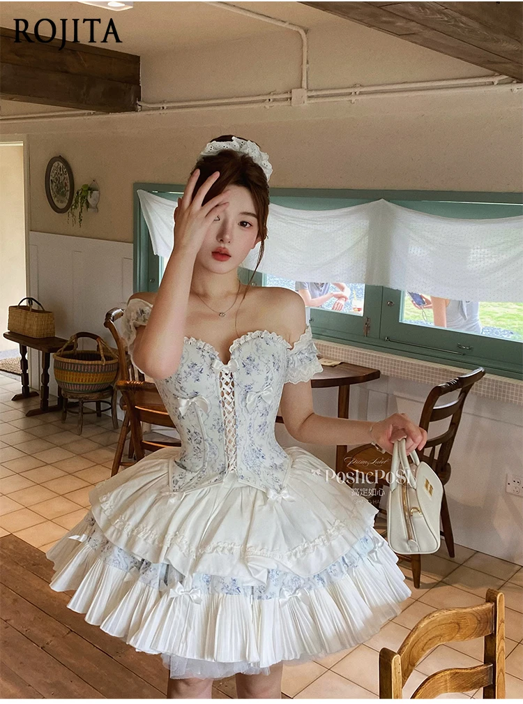 مجموعة تنورة ذات ثنيات علوية بدون أكمام على شكل فيونكة من الدانتيل الحلو بطباعة عتيقة تتضمن عصابة رأس + إكسسوار للرقبة + سوار