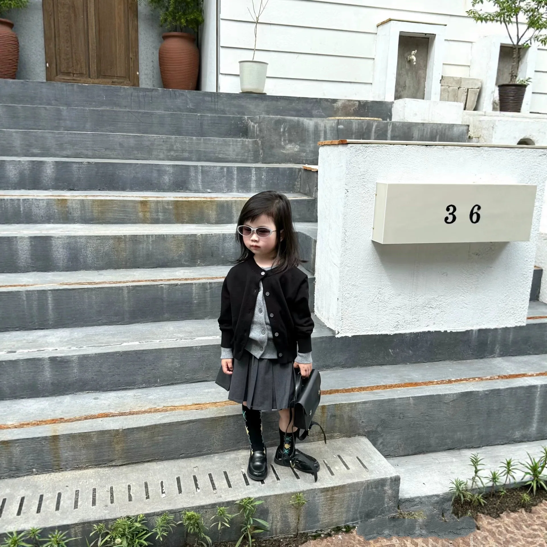 Korean Girls' Set Autumn 2026 New Fashionable Fashionable Black False Two-piece Knitted Shirt Grey Pleated Skirt Two Piece Set