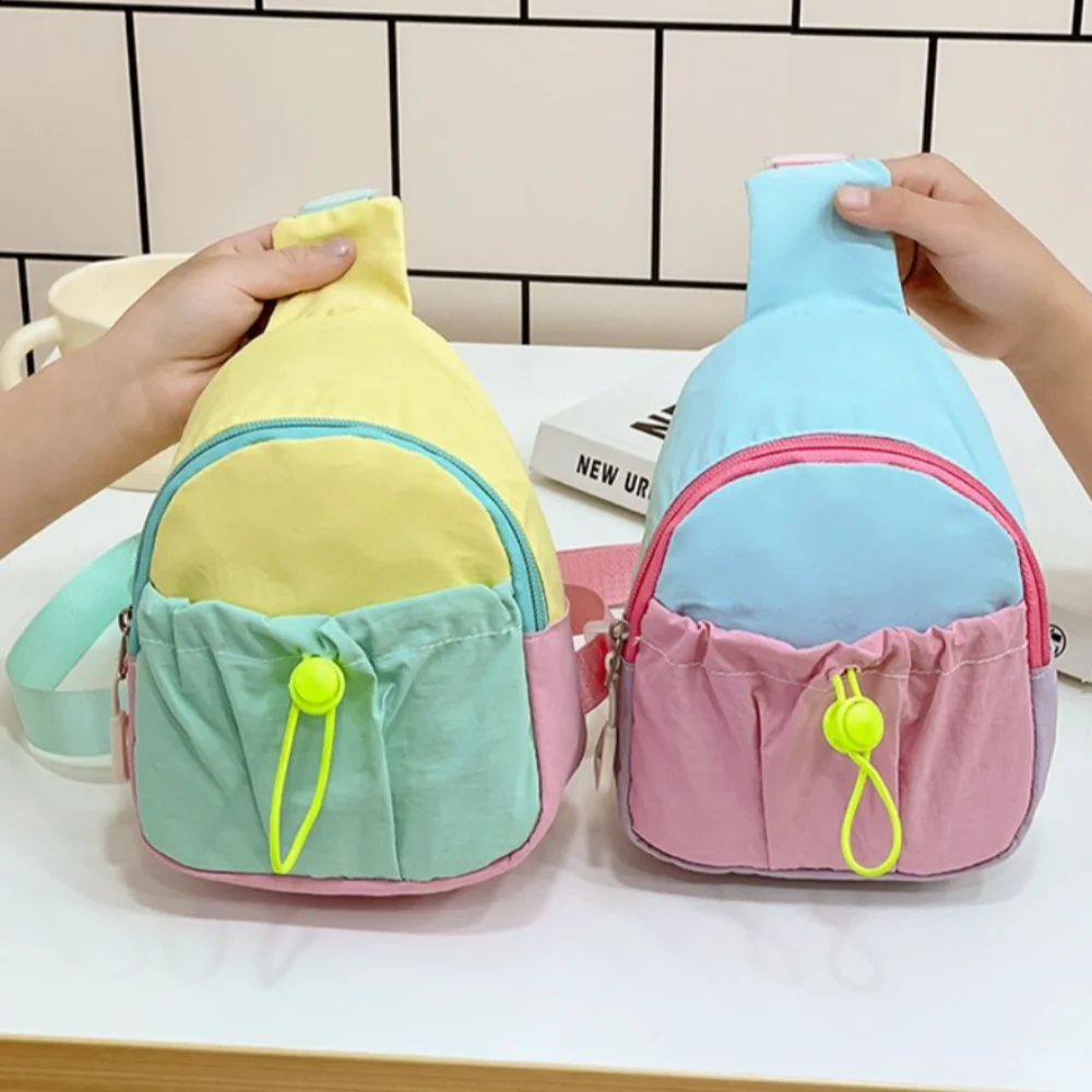 กระเป๋าคาดอกเด็กแฟชั่น ไนลอน ตัดเย็บสีสันสวยงาม น้ำหนักเบา สะพายข้างได้ ใช้เป็นกระเป๋าใส่เหรียญได้ เหมาะสำหรับกิจกรรมกลางแจ้ง