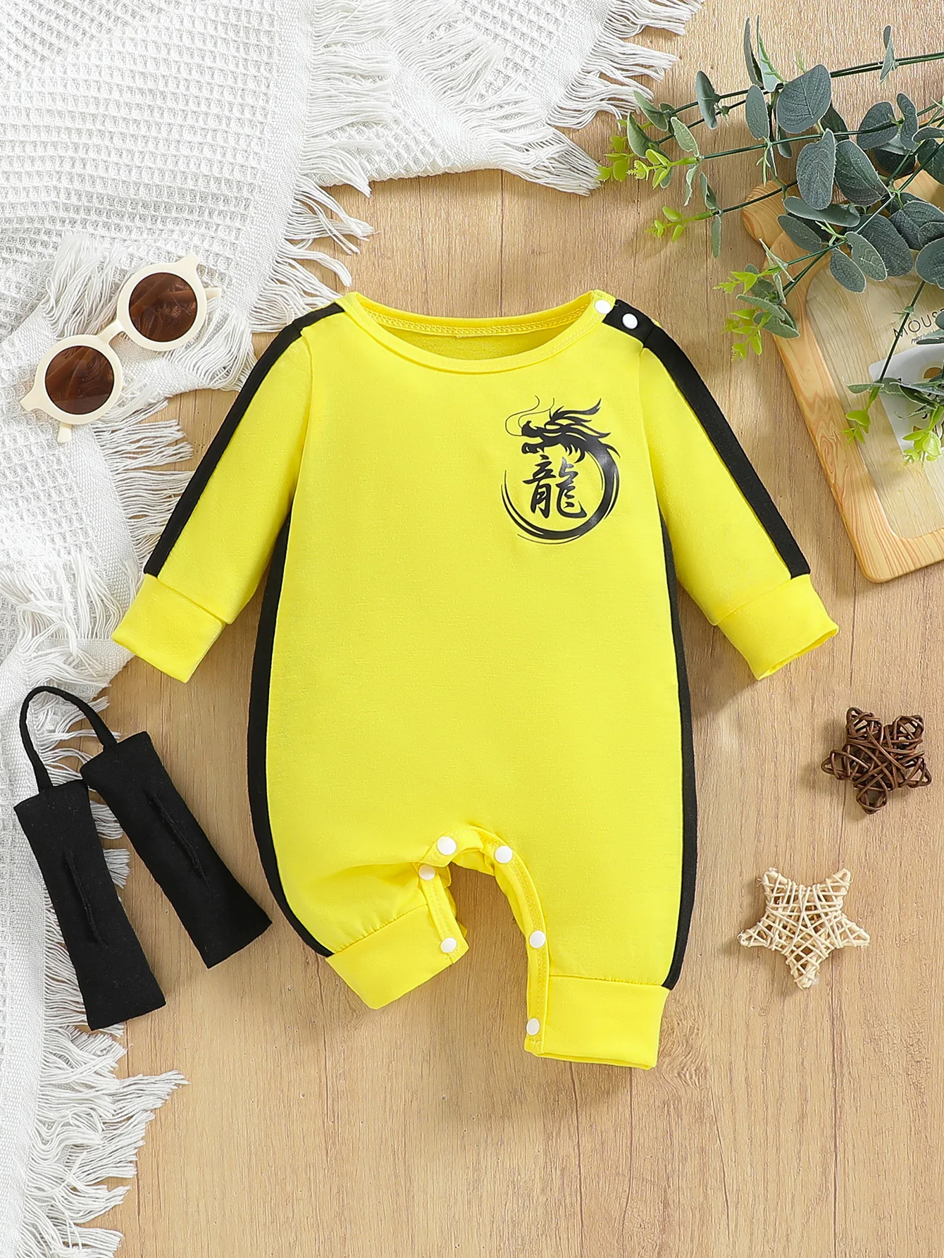 

Baby boy autumn cute jumpsuit with yellow contrasting stitching and dragon pattern print