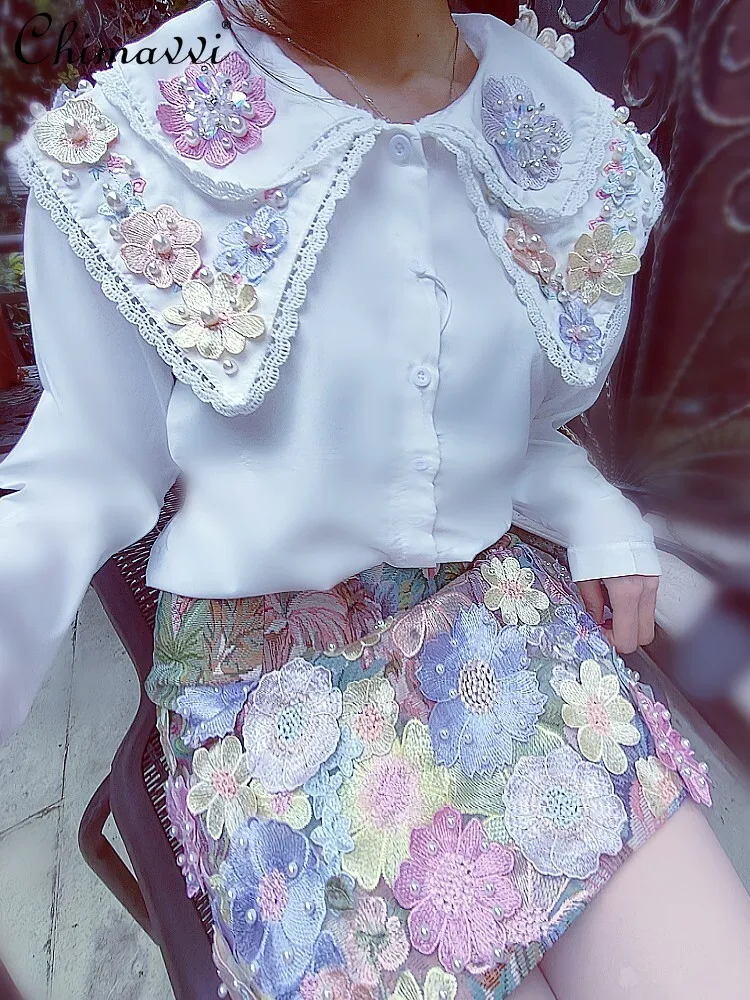 Camicia arruffata con fiore colorato di cristallo tridimensionale della linfa dell\'industria pesante autunno camicetta a maniche lunghe dolce di