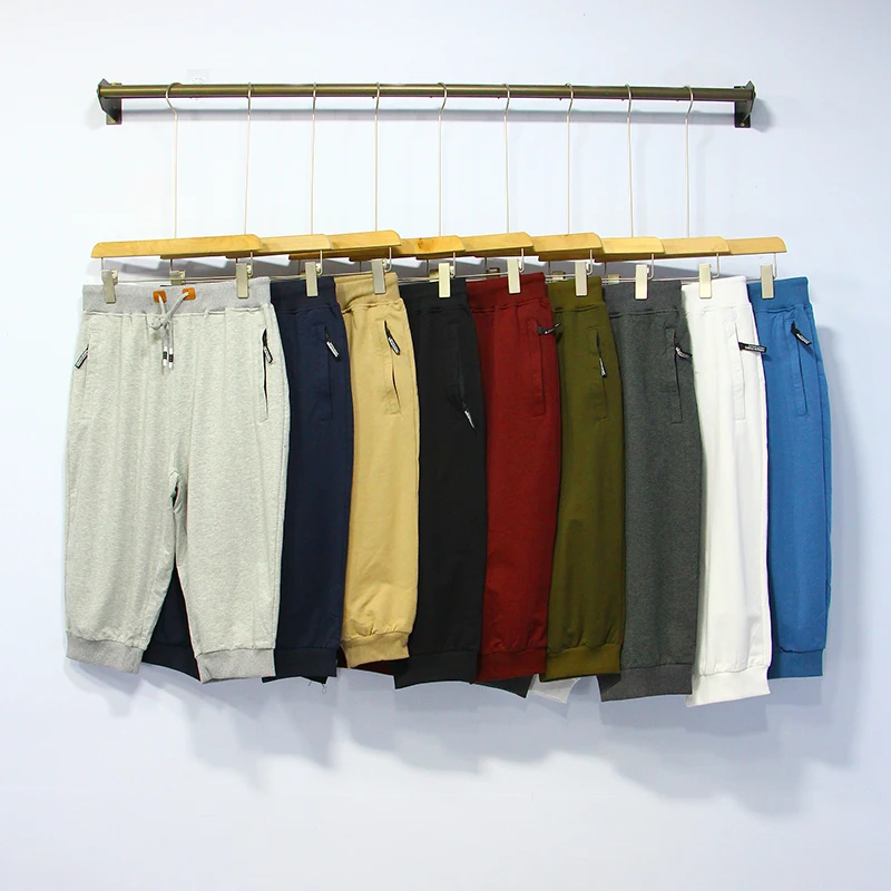 

Мужские летние спортивные брюки свободного кроя, больших размеров, однотонные, трикотажные, с манжетами, длиной 7/8