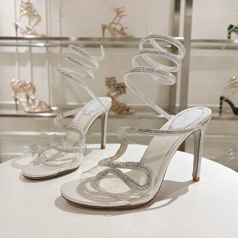 صنادل نسائية صيفية مزخرفة بالكريستال على شكل ثعبان بحزام مطاطي من Sandalias PVC شفافة بحزام واحد وكعب رفيع