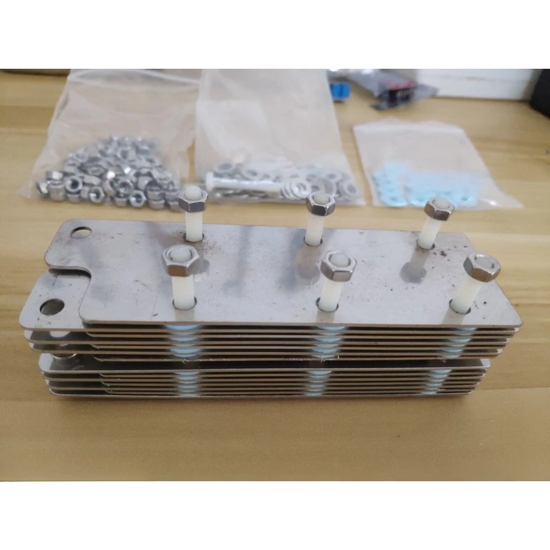 316L Stainless Steel Plates Wet‑type HHO Electrolysis Cell Kit, Complete with Gaskets, Ceramic Insulating Bolts and Fasteners.