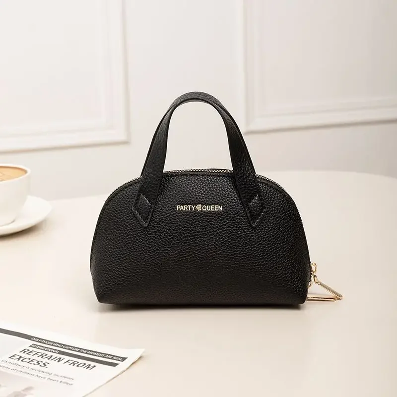 2025, neue schalenförmige tragbare Make-up-Tasche, schöne Handtasche aus schwarzem PU-Leder. Das Leder ist weich, klein und zart.