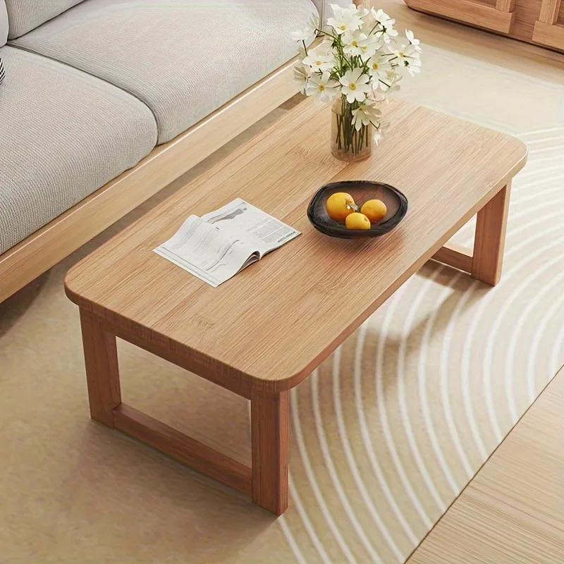 Portable folding coffee table-low-side table suitable for dining and study, ideal for saving space in modern home.