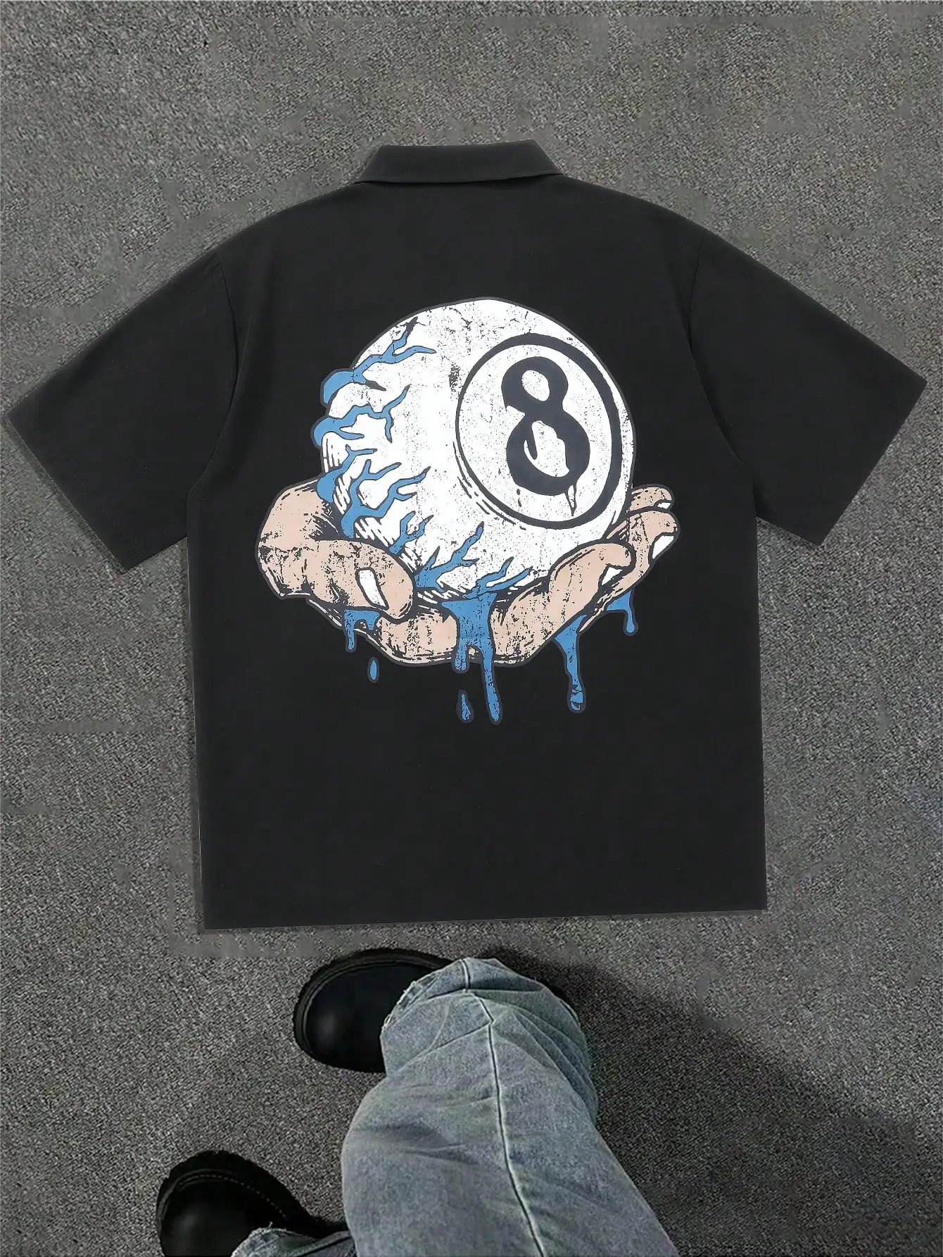 

Men's Black Short Sleeve Polo Shirt with Distressed Graphic Print of Hands Holding Cracked Sphere