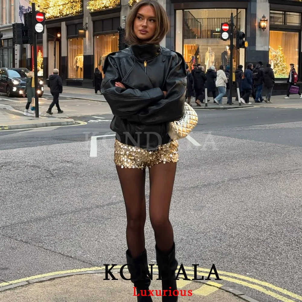 Side view of the KONDALA faux leather jacket, highlighting the sleeve length and pocket details.