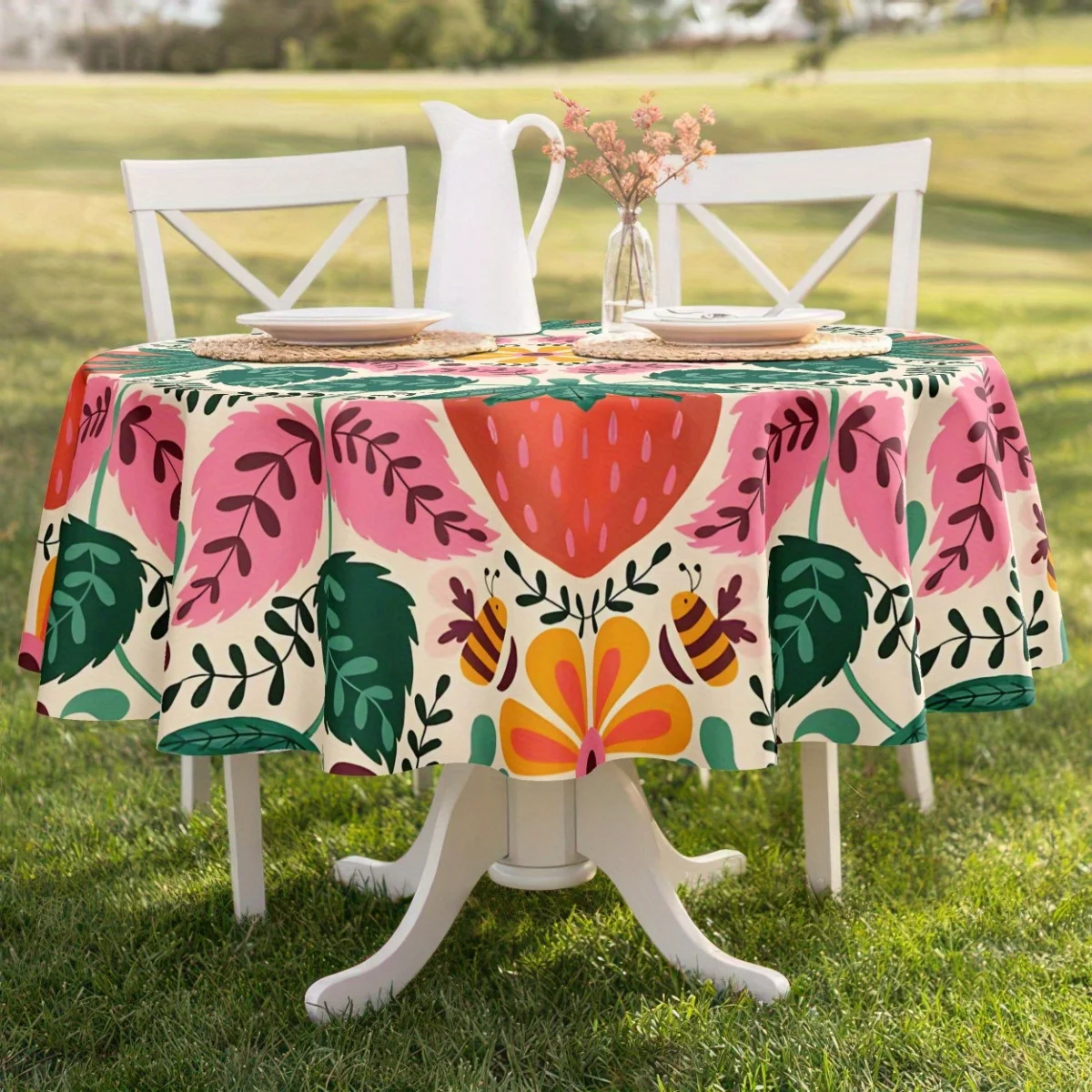A bohemian strawberry and floral tablecloth in vibrant pink, green and orange patterns