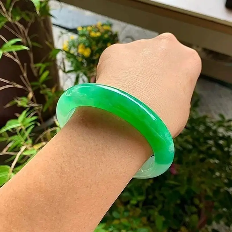 Myanmar A-grade jade bracelet flat strip with a vibrant green color ice-like texture and a traditional style authentic