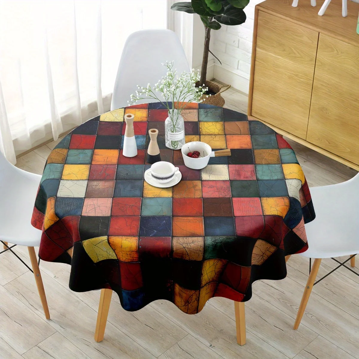 One polyester round tablecloth - featuring geometric patterns in red, black and beige.