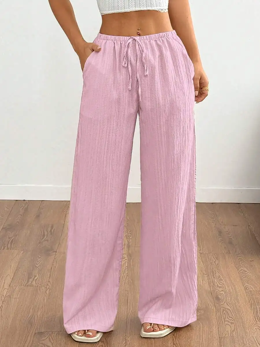 

Женские легкие однотонные брюки с широкими штанинами и завязками на талии