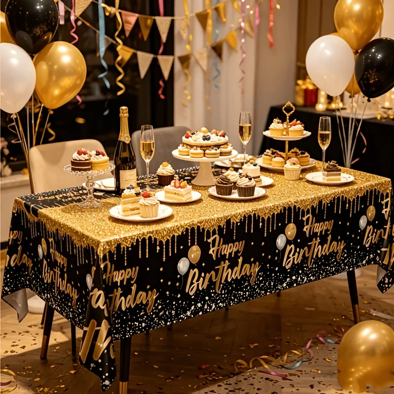 A set of birthday party tablecloths, in black and gold color scheme.PMJ