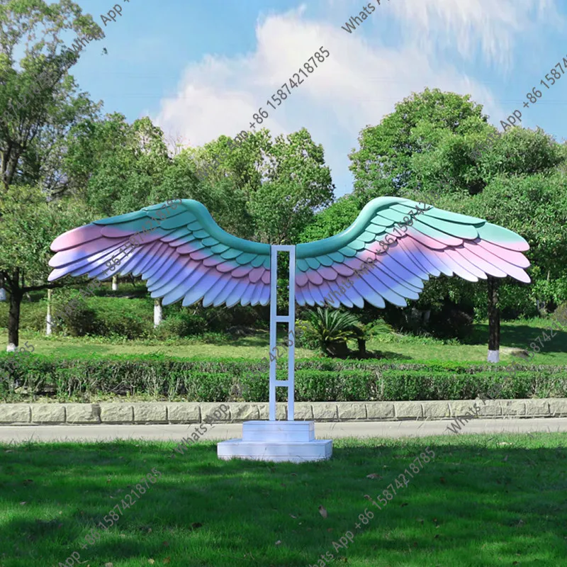 Clock in outdoor wing sculpture ornament park scenic spot campground flower sea lawn landscape decoration