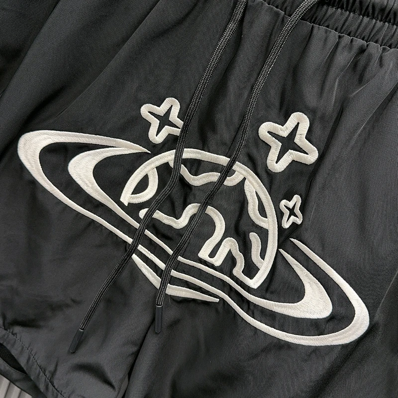 黒刺繍コスモススターリングバスケットボールショーツメッシュ速乾性 Jorts 男性女性ルーズ巾着ウインドブレーカースポーツショートパンツ